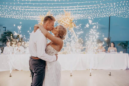 Destination wedding couple dancing during reception celebration
