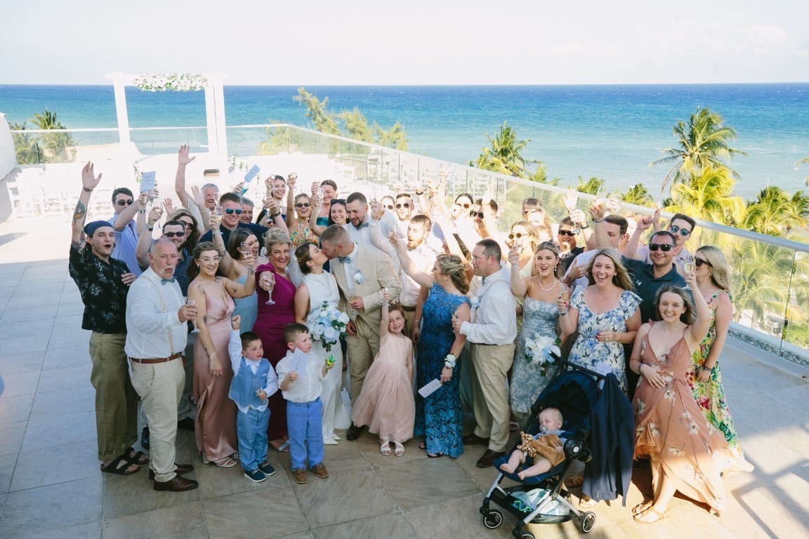 Couple celebrating with guests after a destination wedding ceremony